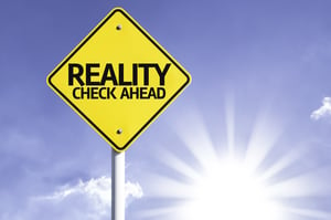 Reality Check Ahead road sign with sun background